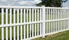 White vinyl fence installed in a residential yard, providing low-maintenance and long-lasting fencing in {city}, {state}